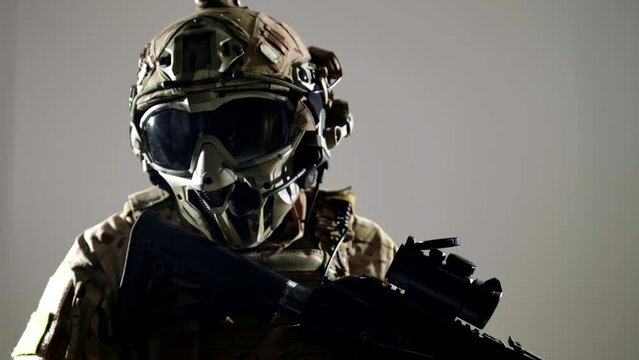 combatant of war conflict, portrait of modern soldier with rifle in studio, unrecognizable warrior