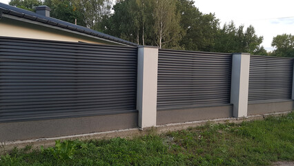 Obraz premium Modern metal fence with shutters
