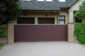 Brown automatic sliding metal gate with corrugated sheet