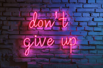 "Don't give up!" Sign In Neon Lights on the dark brick wall. motivational phrase written with pink neon lights on a brick wall.