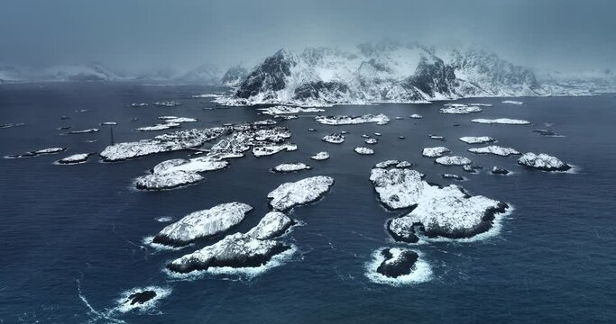 Panorama winter landscape of nordic fjords Lofoten Islands, Norway, seascape and Henningsvaer stadion covered in snow