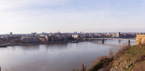Panoramic view of cityscape of Novi Sad, bridge over Danube river. Downtown at riverside. Cloudy...