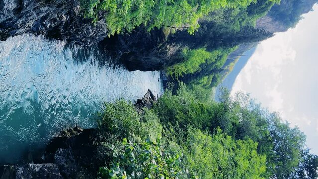 The Bolshaya Laba River. A mountain emerald river in a narrow, sunlit canyon. Bolshaya Laba River near the village of Psemen in Karachay-Cherkessia, Russia. Panoramic view. 4K