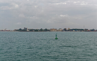 The view of Guinea Conakry from a Crew Vessel heading in to Port with The Parliament Building in...