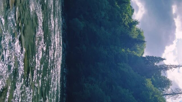 The Bolshaya Laba River. A mountain emerald river in a narrow, sunlit canyon. Bolshaya Laba River near the village of Psemen in Karachay-Cherkessia, Russia. Panoramic view. 4K