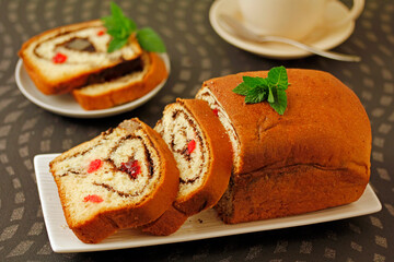 Sponge cake with chocolate and fruits.