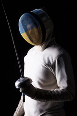 Ukrainian fencer on a black background