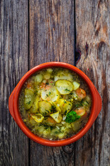 Cucumber soup on wooden table
