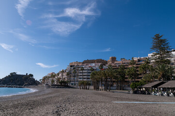 Fototapeta na wymiar View of the popular Puerta del Mar beach in Almuñécar (Spain) on a sunny winter morning