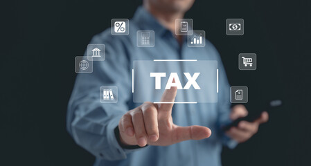 E-tax concept with a businessman displaying TAX on an Individual income tax return form online for tax payment. emphasizing data analysis, paperwork, financial research, and report.