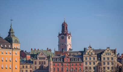 Court house with towers, the old town Gamla Stan with 1700s houses and the church tower of Storkyrkan, a sunny winter day in Stockholm