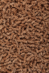 Pasta di Lino or Flaxseed gluten free pasta, close-up. Fusilli made from flax and corn flour. Low glycemic index food