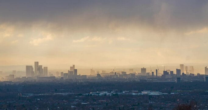 Time lapse video showing fast moving  clouds drooping rain over Manchester Skyline 