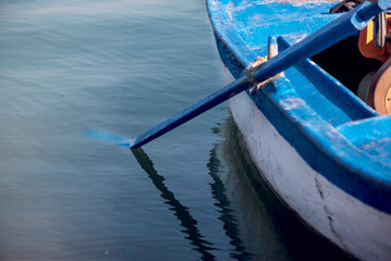 Blue colored fishing boat on the river, close up, details