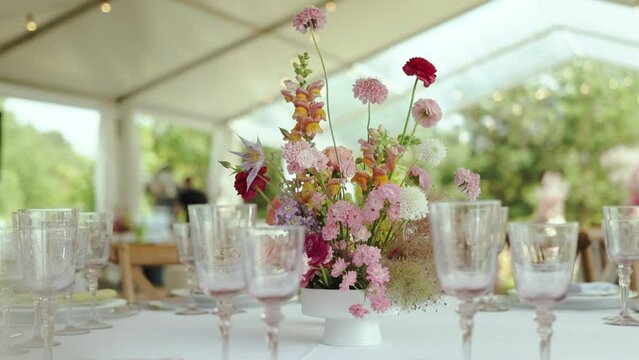 Beautiful flower vase centerpiece enhances wedding reception table decor