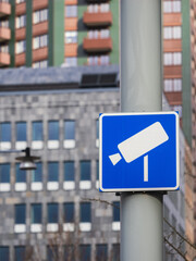 Blue Toll Road Sign Indicating Surveillance in Gothenburg Against Urban Backdrop