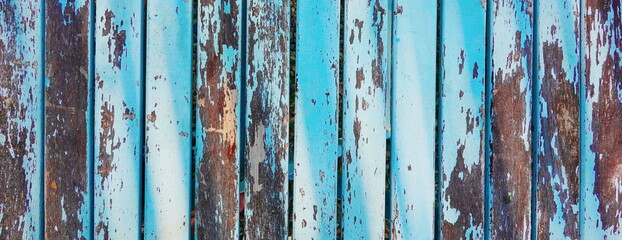 Aged Patina on Weathered Blue Wooden Boards. The Rustic Charm of Faded Paint and Time-Worn Wood