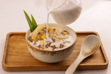 Thai Dessert, Sago or Tapioca Pearls Pudding with Corn and Coconut Milk.