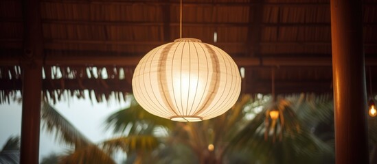 A white paper lantern is suspended from the ceiling, casting a soft glow in the room. The lantern sways gently with any movement in the air, creating a calming ambiance.