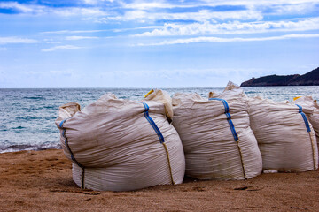 Geomaterials. sandbags to strengthen the shore from waves
