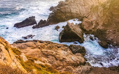 Punta Playa Cometa sunset panorama view mountains rocks Mazunte Mexico.