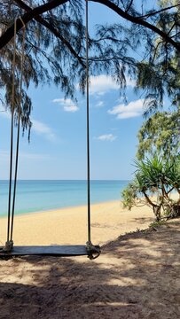 Swing on Paradise Thai Beach and blue sea