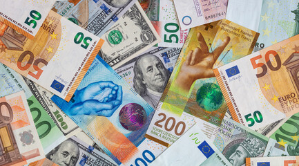 Closeup of  Swiss franc, US dollar, Euro, polish zloty banknotes  banknotes