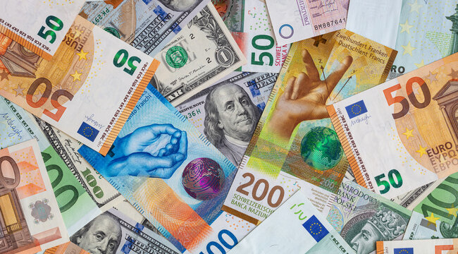 Closeup of  Swiss franc, US dollar, Euro, polish zloty banknotes  banknotes