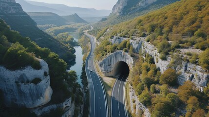 A bird's eye view of a car tunnel in the mountains. Beautiful wallpapers for tourism and...