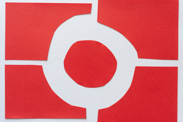 letter o or number zero composed of four pieces of red paper