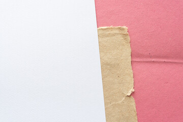 blank textured paper, cardboard paper corner, and rough pink paper with crease fold