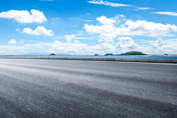 Empty asphalt road and sea with mountain landscape