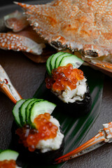 In an upscale restaurant, a beauty enjoys seafood, whiskey, and wine. Kamchatka crab and premium caviar elevate sushi. A tasty octopus is a treat. The bartender and sommelier expertly pair wines 