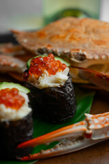 In an upscale restaurant, a beauty enjoys seafood, whiskey, and wine. Kamchatka crab and premium caviar elevate sushi. A tasty octopus is a treat. The bartender and sommelier expertly pair wines 