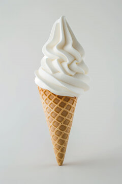 A soft serve ice cream in a waffle cone.