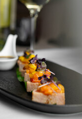 In an upscale restaurant, a beauty enjoys seafood, whiskey, and wine. Kamchatka crab and premium caviar elevate sushi. A tasty octopus is a treat. The bartender and sommelier expertly pair wines 