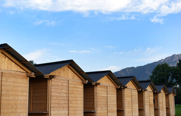 Fototapeta premium Wooden houses against the backdrop of mountains