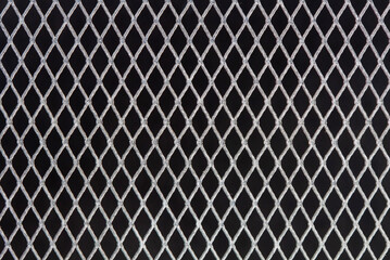 Wire fence isolated on black background