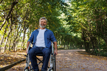 Obraz premium Freedom Amidst Nature: Park Visit for Wheelchair User