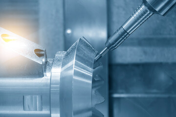 Naklejka premium The 5-axis CNC milling machine cutting the automotive part with solid ball end mill tool.