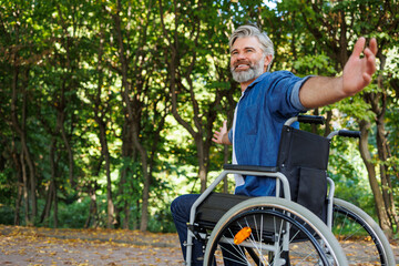 Elevating Inclusivity: Wheelchair-bound Man Enjoying Park Freedom