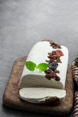 Nut nougat with dried fruit sweet candy on gray background
