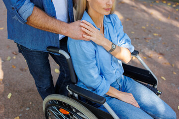 Wheeling Through Nature: Disabled Couple Enjoying Park Stroll