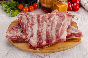 Raw pork ribs over board