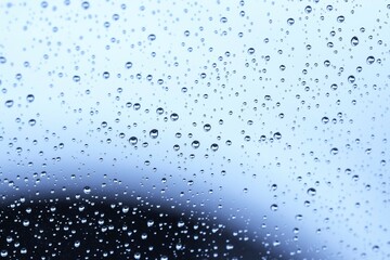 Raindrop Rhythms: Abstract Water Patterns on Glass,