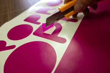 A cutting stencil.A selection of letters from vinyl film.Plotter cutting.