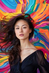 Fototapeta premium Vibrant Portrait of Young Woman with Flowing Hair Against a Colorful Abstract Background