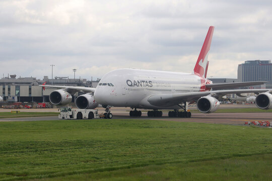 London, Heathrow, UK, 5.05.2023 - An Airbus A380 of the Australian company Qantas is docked in Heathrow airport (LHR) in a cloudy day.