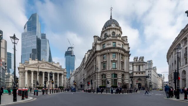 Time lapse view of the City of London with modern office skyscrapers and the Bank of England and Royal Exchange