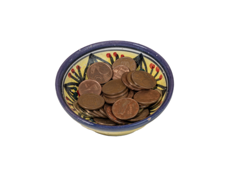 some euro pennies in a decorated bowl - Powered by Adobe